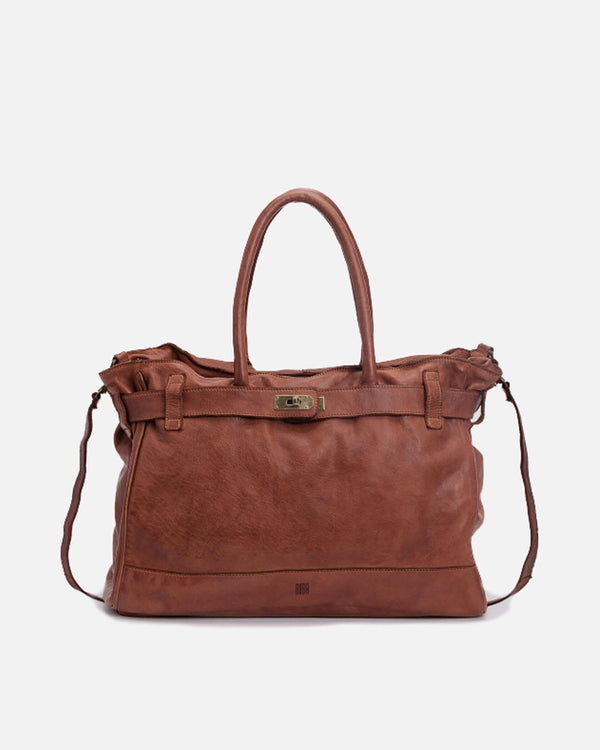 Detailed frontal view of a brown Blossom Leather Kelly Bag against a white backdrop
